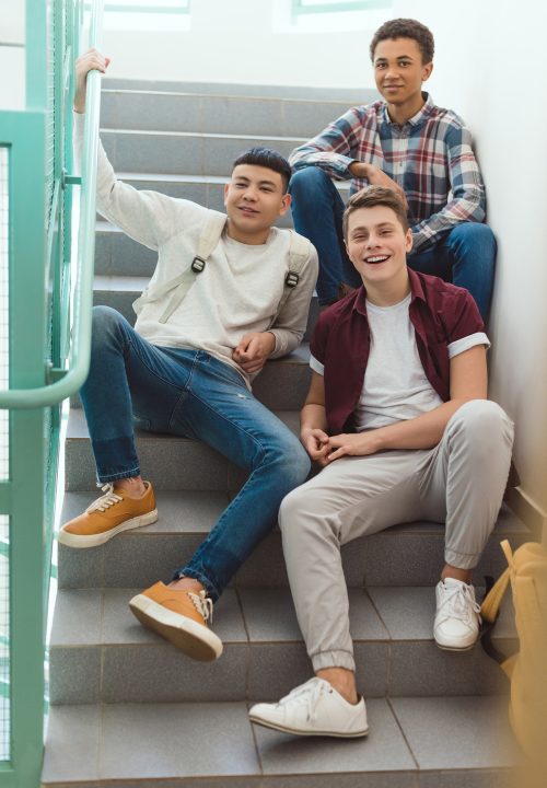 teenage schoolboys sitting on stairs at school and l4mn3ul.jpg
